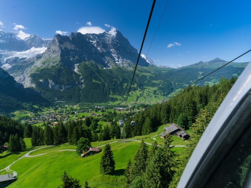View of mountains, woods and villages from a cable car