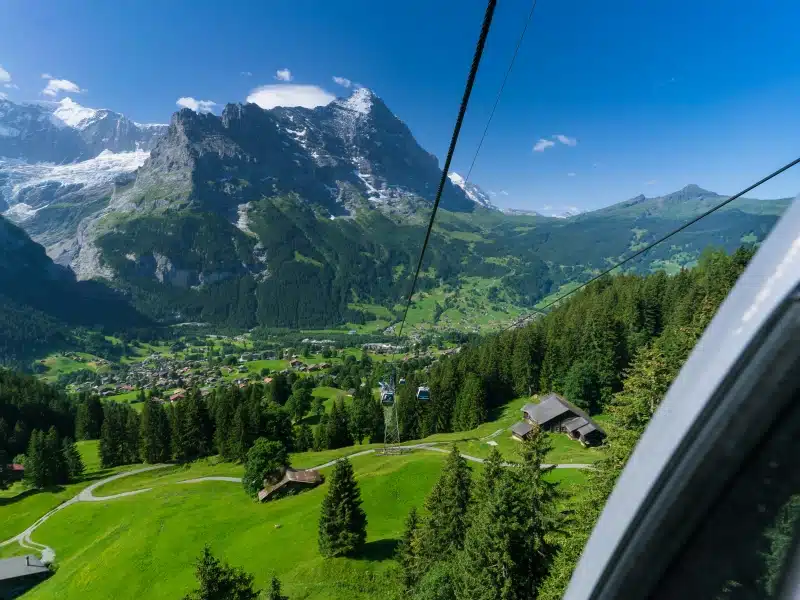 View of mountains, woods and villages from a cable car