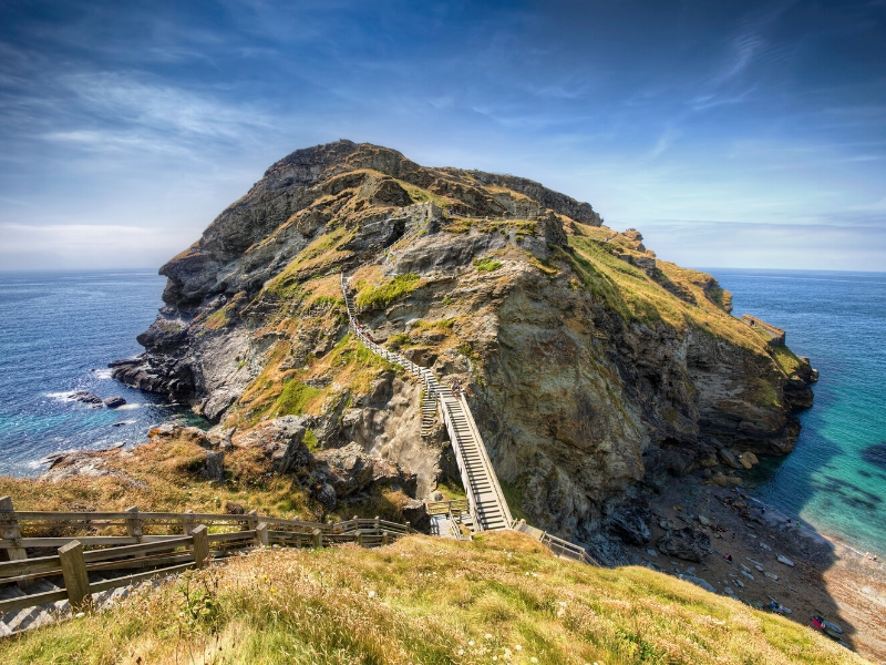 stairs and a bridge to a rocky outscrop in the sea