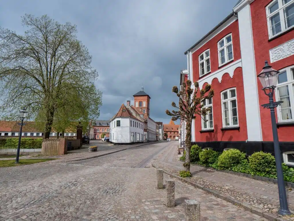 red and white building on a cobbled street