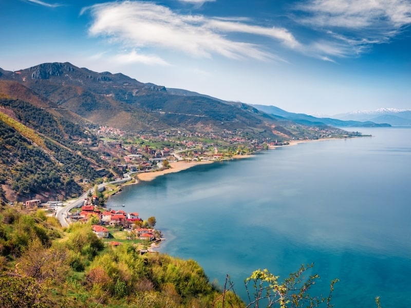 Colorful spring cityscape of a lakeside town on a sunny day