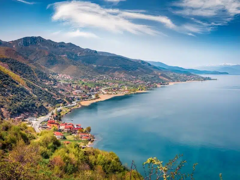 Colorful spring cityscape of a lakeside town on a sunny day