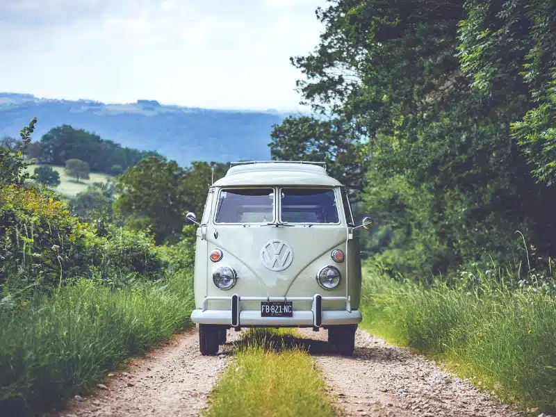 campervan on a gravel track in France surrounded by countryside