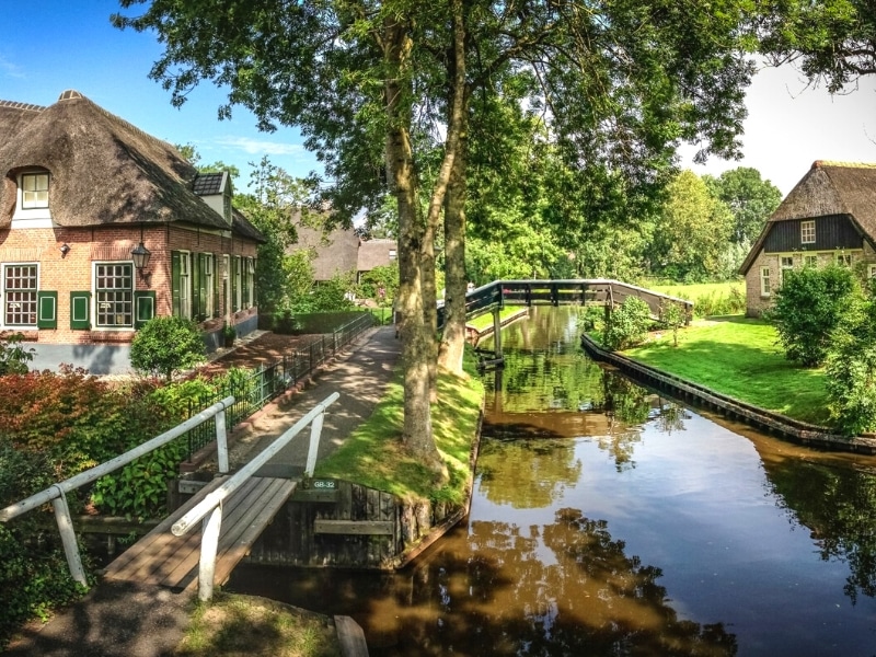 canal and farmhouses in a rural setting 