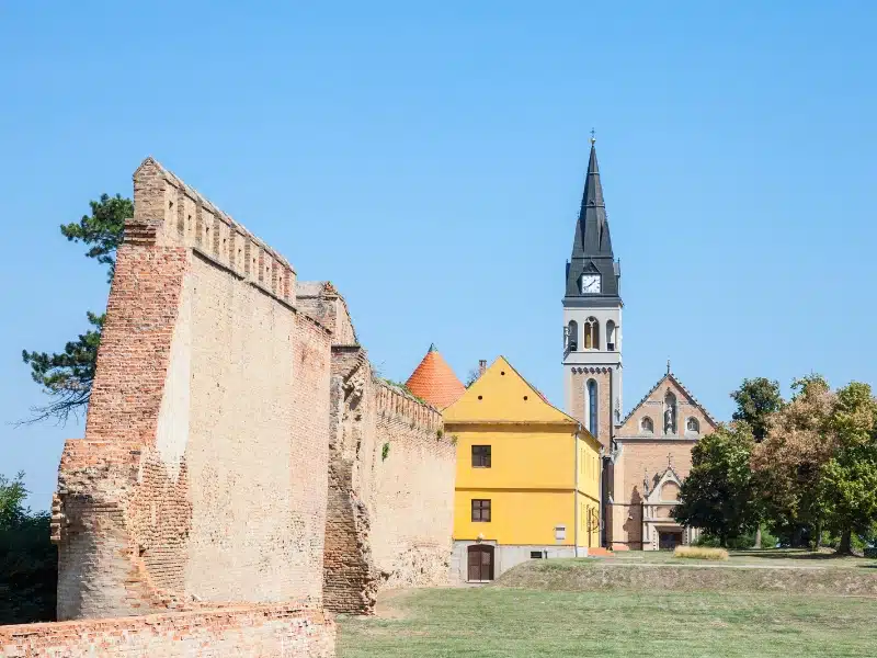 Old walls, a yellow house and grety spire