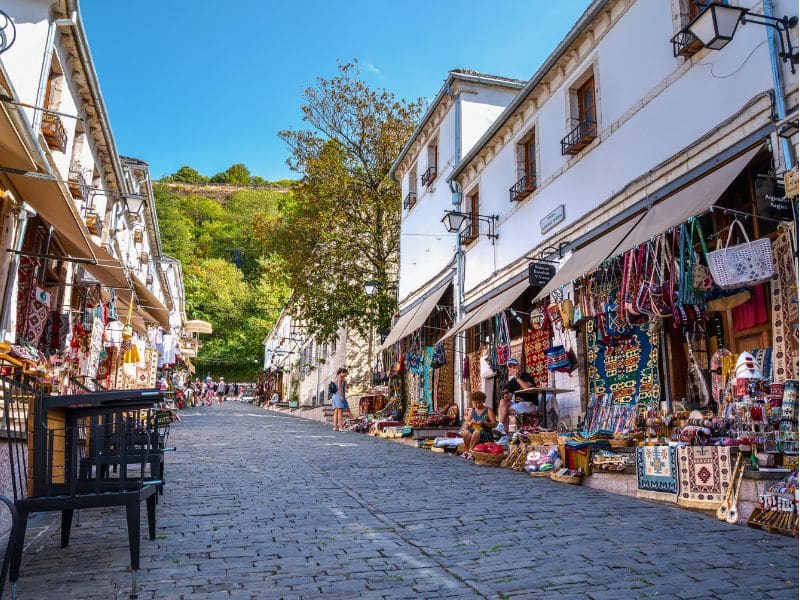 cobble streets lined with white painted buildings and craft shops