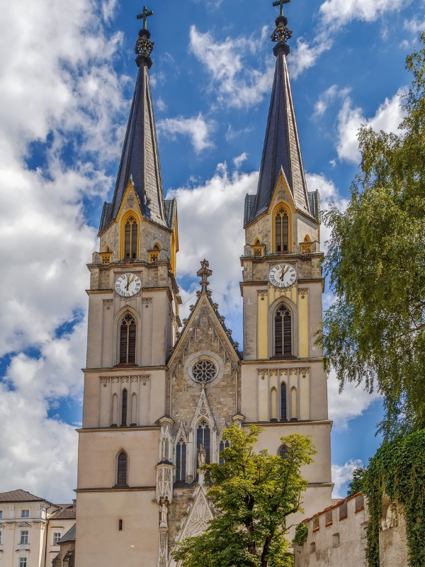 Twin church towers with two clocks