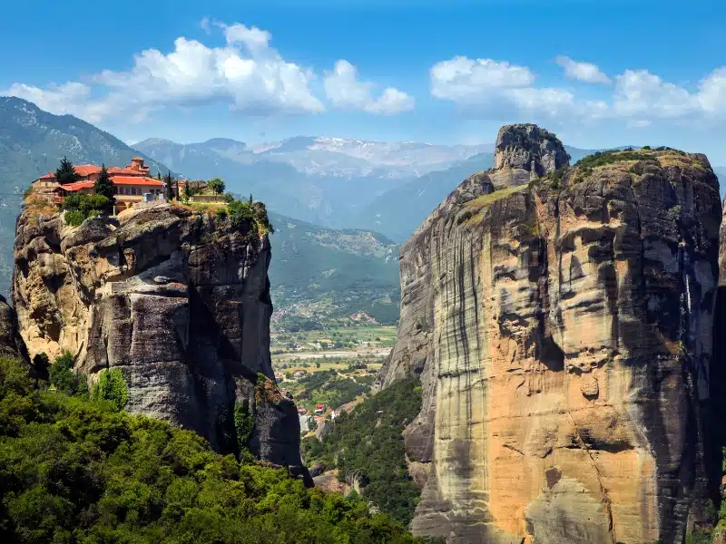 Red roofed monastery on a high rock stack