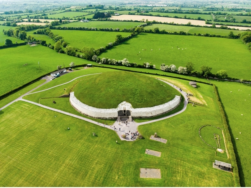 Historic burial chanmer surrouned by green fields