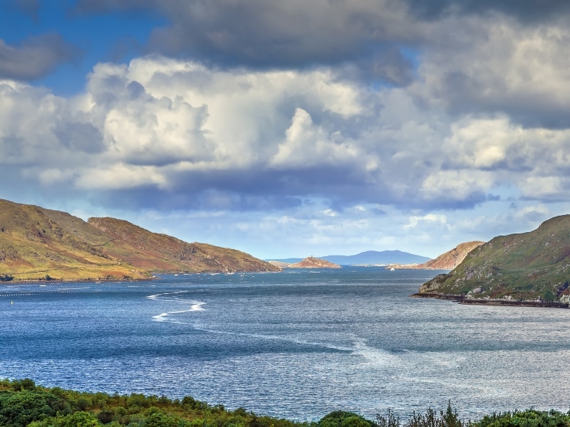 Large body of water surrounded by rocky hills