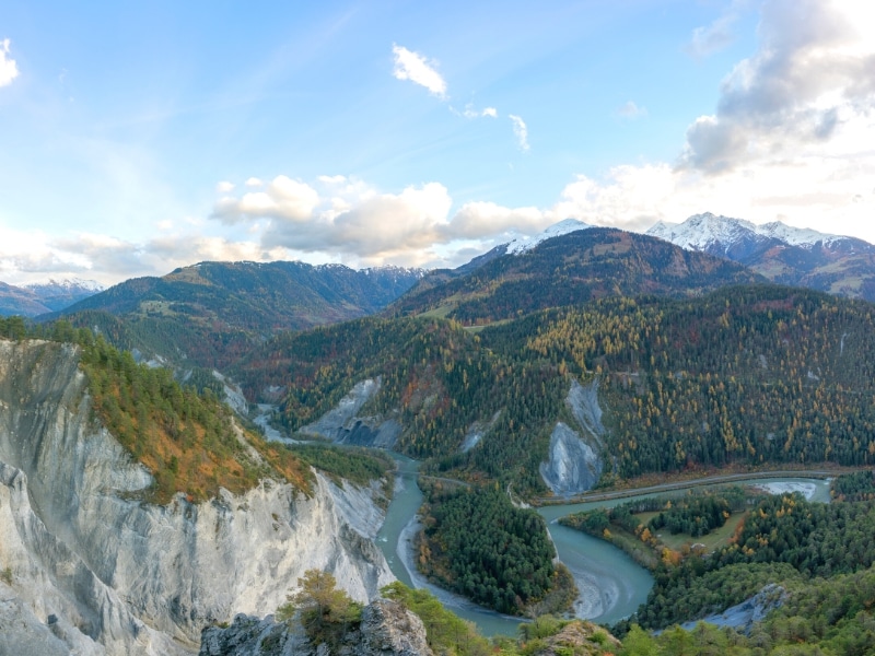 Horseshoe bend on a large river running through mountains