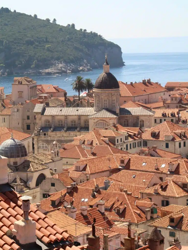red roofs of an old town in Croatia and a domed church building
