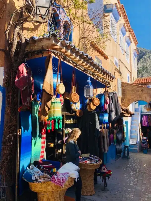 Small shop painted blue selling handicrafts and bags