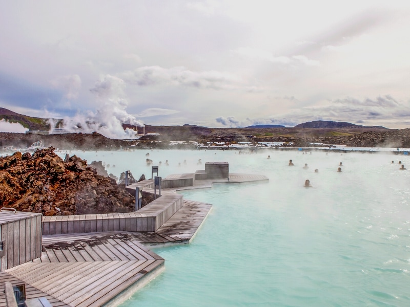 Turquoise thermal spa waters with people swimming