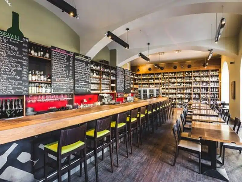 wine bar with a large blackboard and many table and chairs