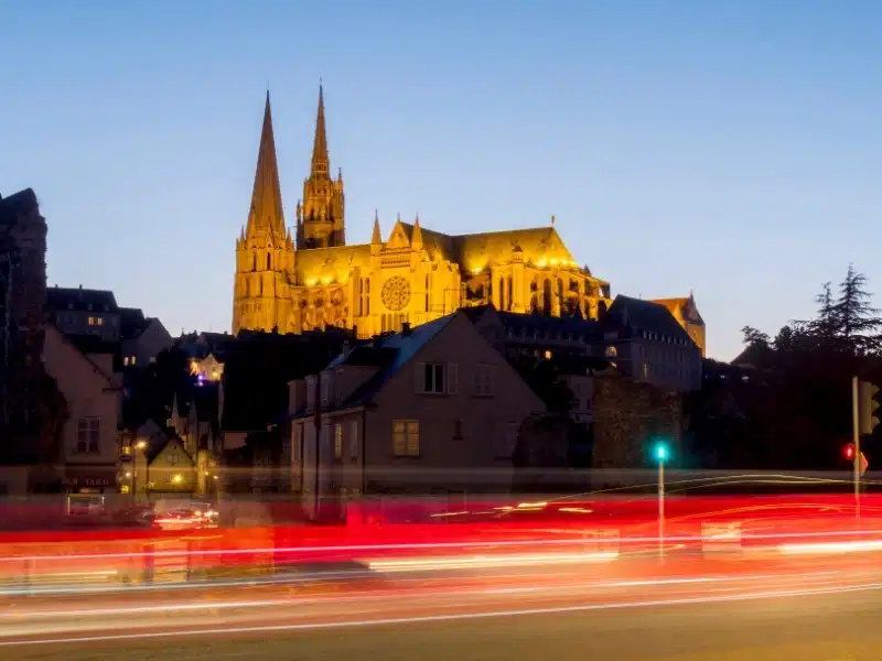 Chartres Cathedral, UNESCO World Heritage site seen from a busy night time road