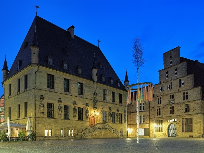 Typical German buildings with gable fronts and steep and deep roofs on either side of a square