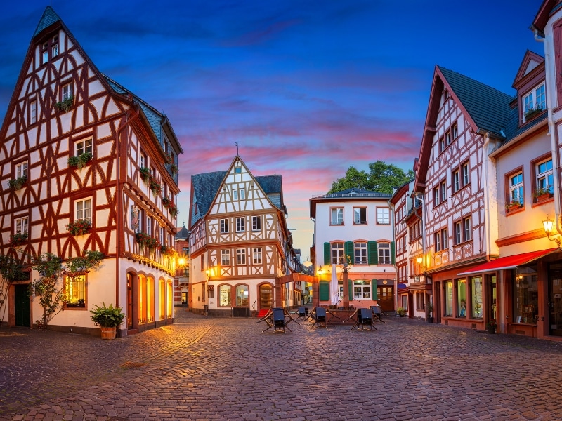 red and white half timbered houses around a cobbled square
