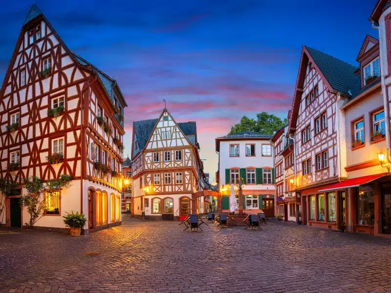 red and white half timbered houses around a cobbled square