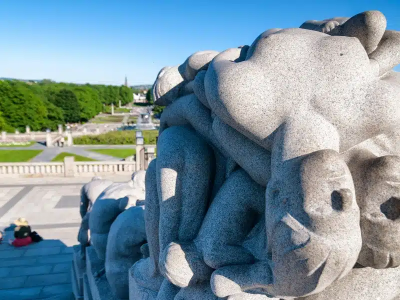 granite sculptures against a park backdrop
