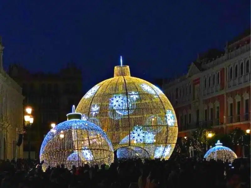 giant christmas tree baubles lit by fairy lights