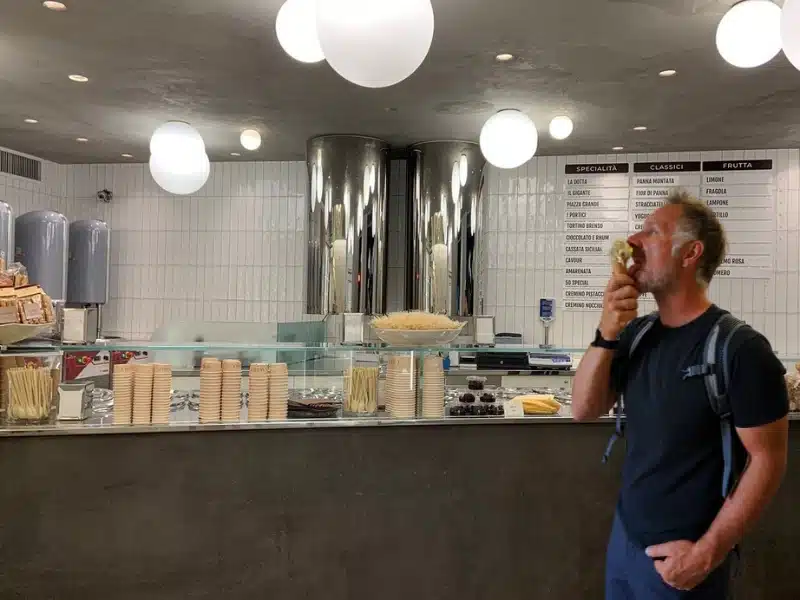 Phil eating a gelato cone in a famous gelato shop in Bologna