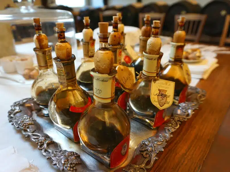 bottle of balsamic vinegar of Modena on display on a silver tray