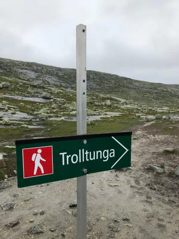 red and white signage to Trolltunga in Norway