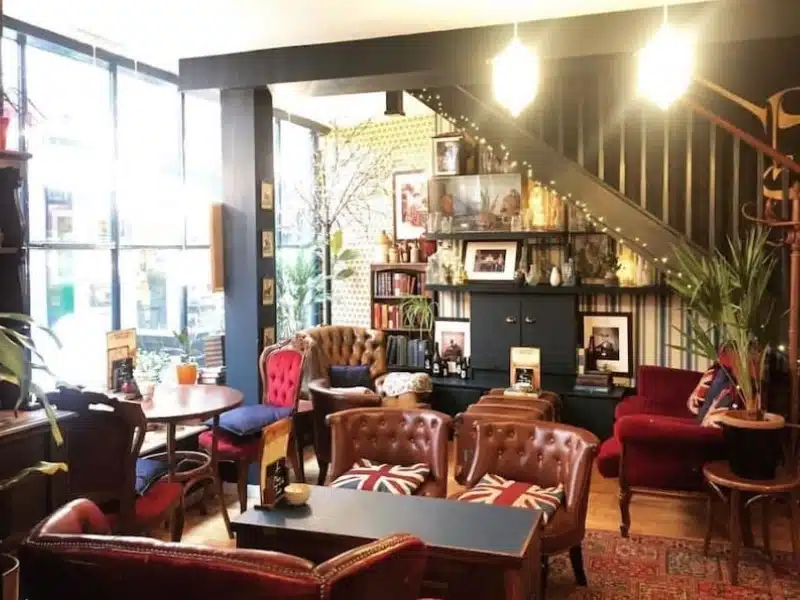 cafe with cosy club chairs and bookcases