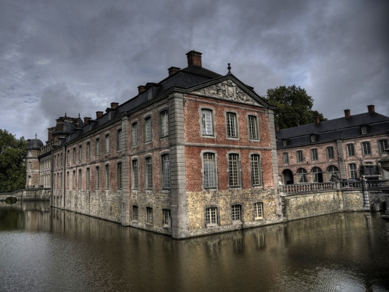 elegant palace with many windows in a moat