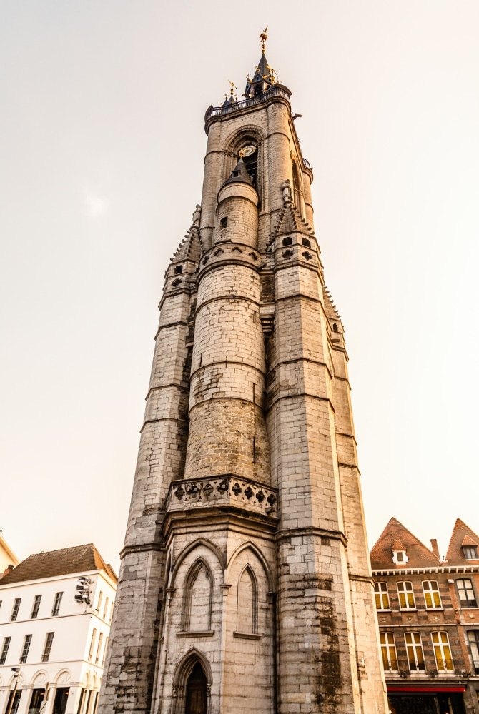 Tall creamy stone clock tower