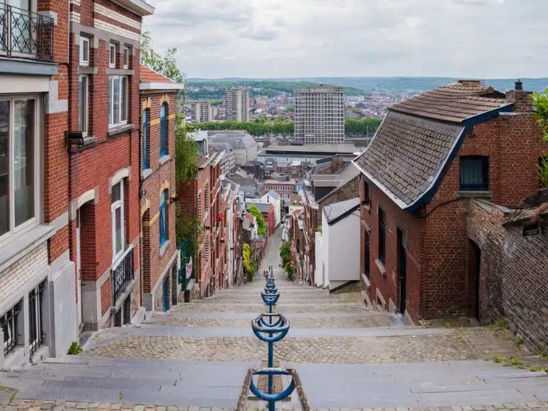 cobbled steps going down past houses into an urban environment