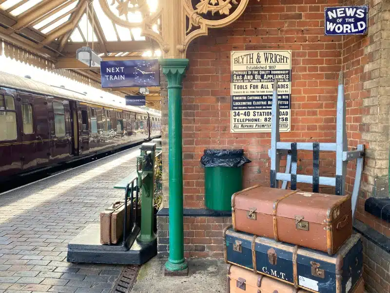 suitcases and nostalgic items on an historic train station platform