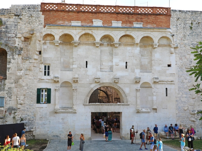 stone palave building with small doorway and slit windows