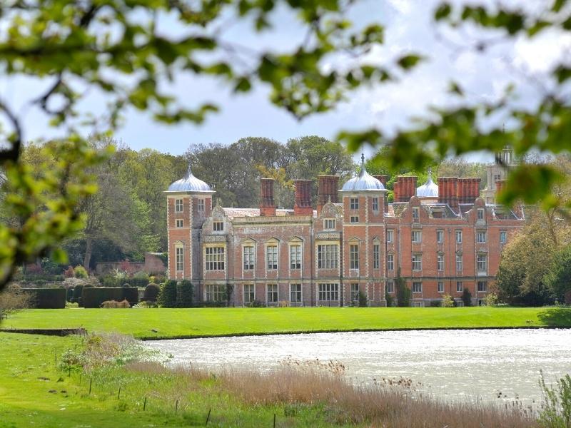 statwly home with silver dome topped towers and many windows