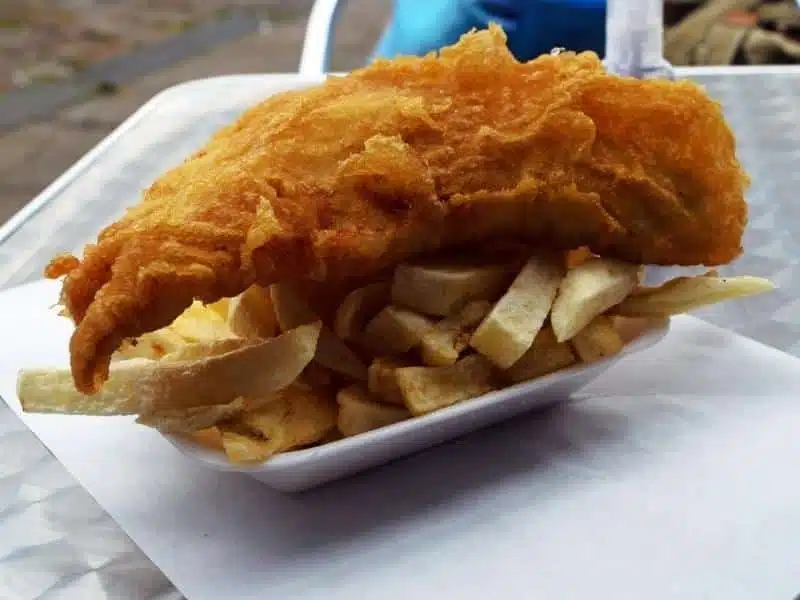 fish and chips in a polystyrene tray