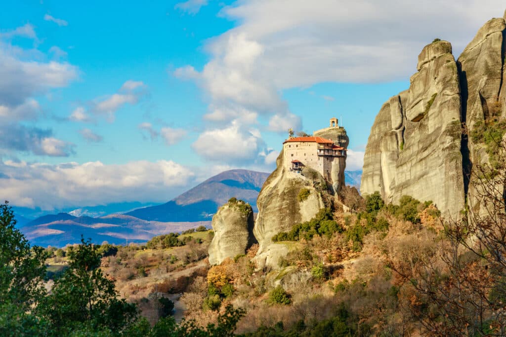 small building built into a tall rocky outcrop