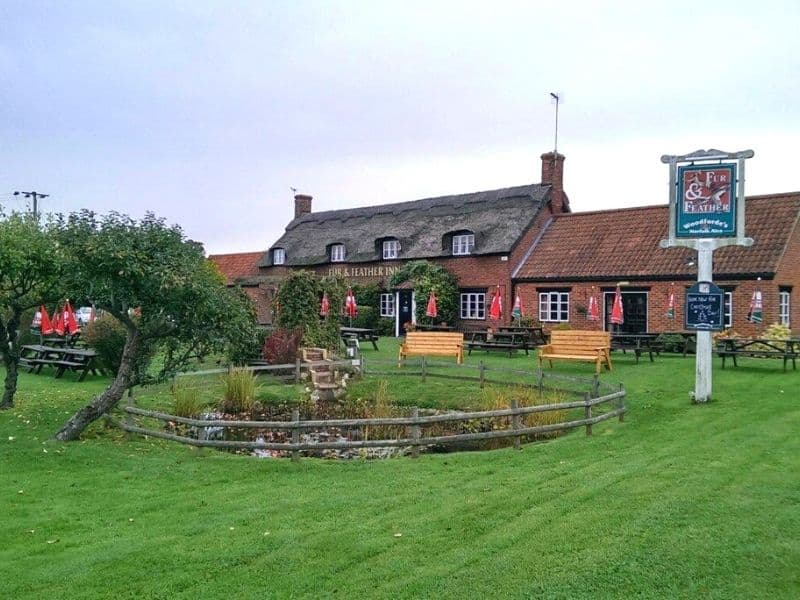 traditional Norfolk pub with a lawn and outside seating