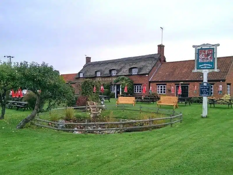 traditional Norfolk pub with a lawn and outside seating