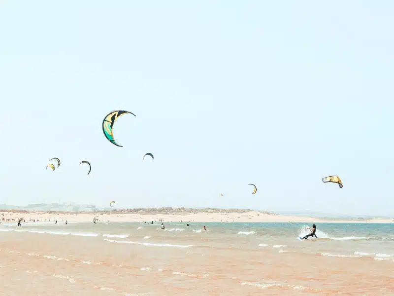 people kite surfing from a beach