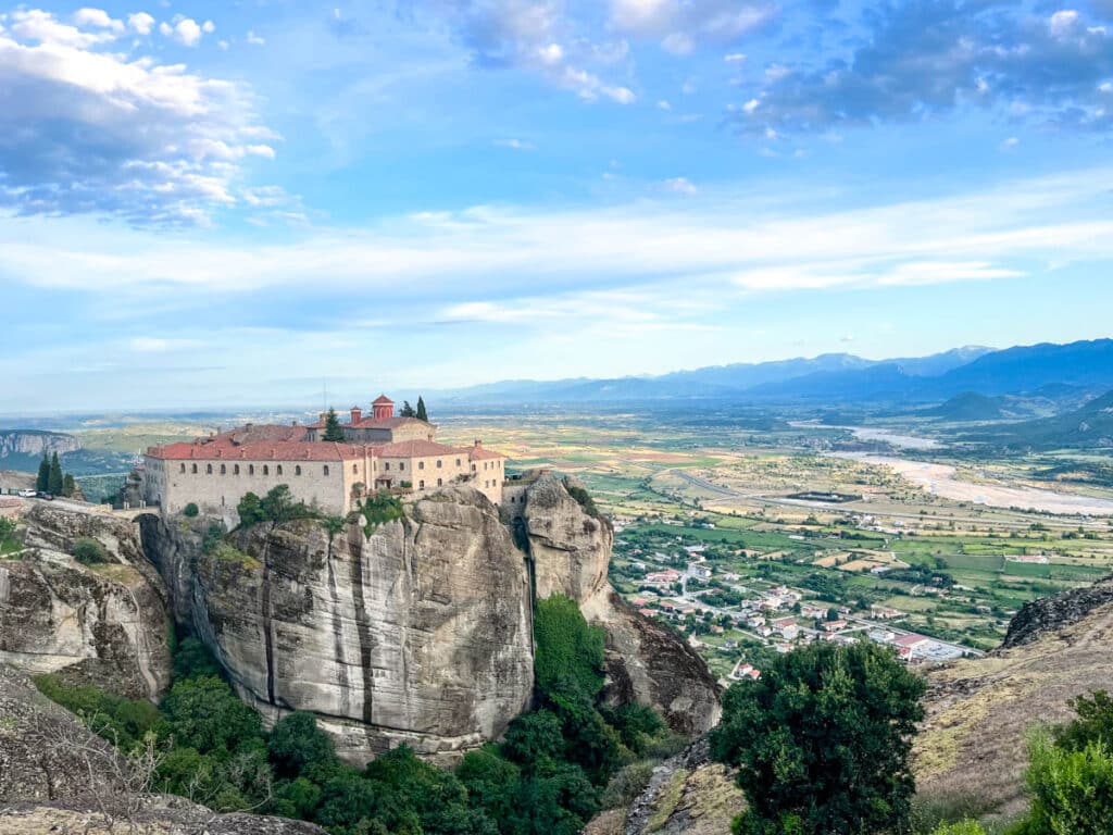 landscape of a valley with buildings surrounded by mountains