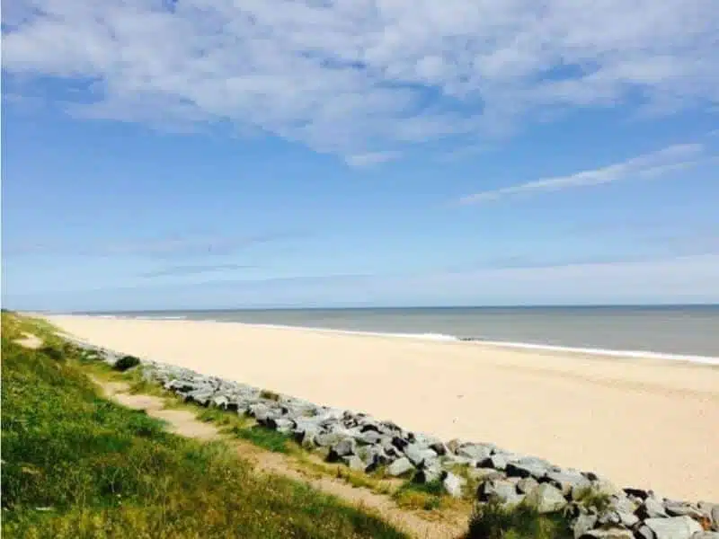 clean sandy beach with rocks to protect from coastal erosion