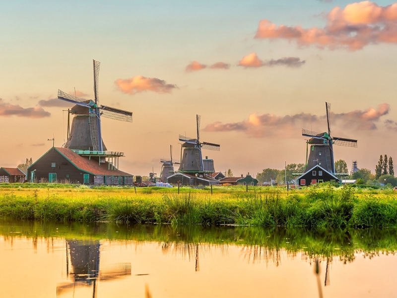 Windmills in Zaanse Schans, Netherlands traditional village in Holland at sunset