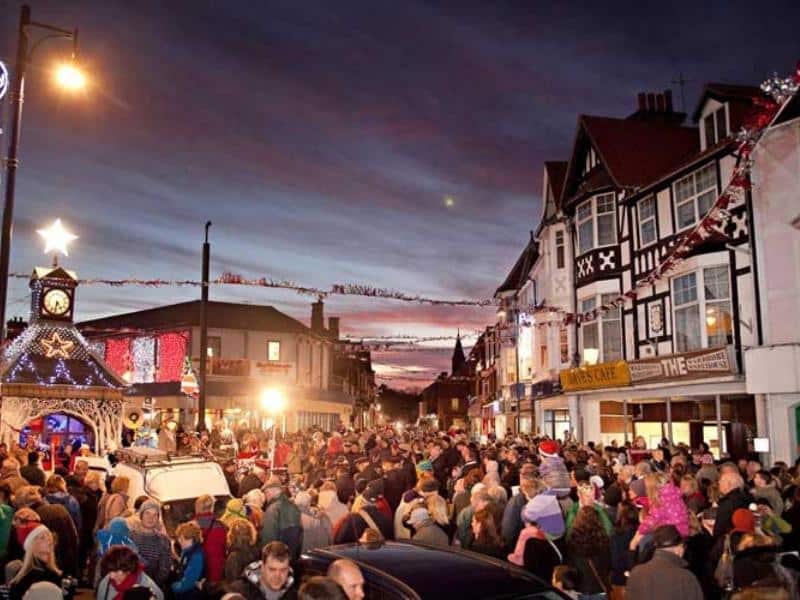 people celebrating at a street carnival