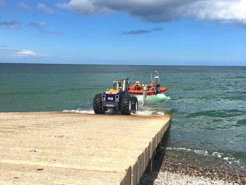 tractor launching in inshore lifeboat from a concrete slipway