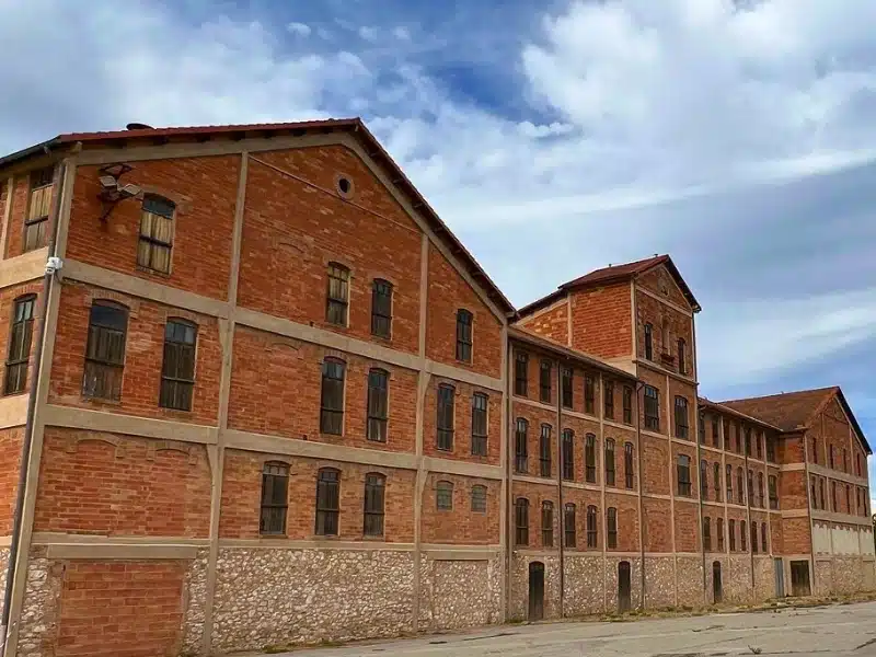 large brick and stone building with many windows 