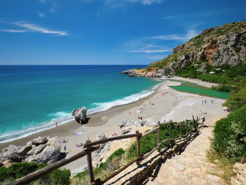 View of Preveli Beach with relaxing people and Mediterranean sea. 