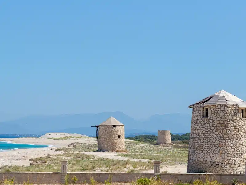 Ancient windmills on Agios Ioannis Beach, Lefkada, Greece