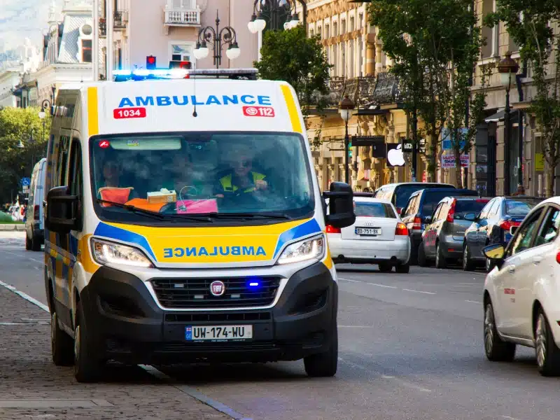 yellow and Blue ambulance in the street of Tbilisi