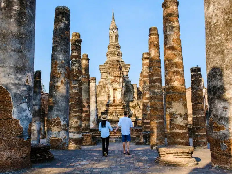 Tourists visiting ancient city and culture of Thailand